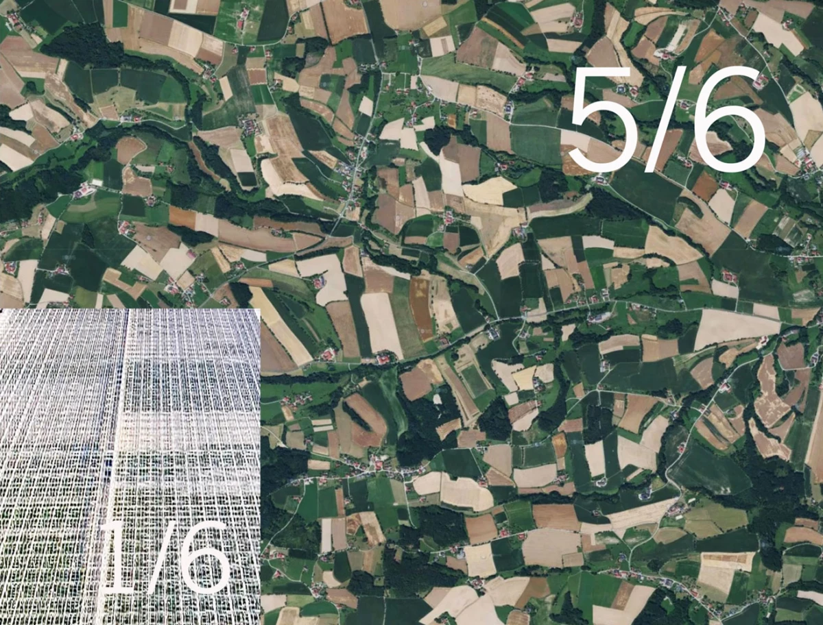 Aerial view of patchwork farmland; a large solar panel array occupies the bottom-left corner.