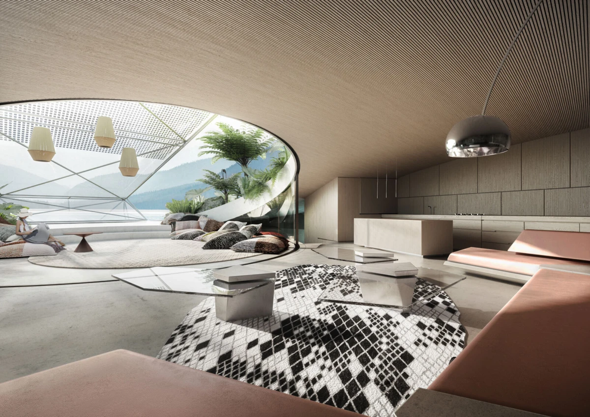 Open-concept living area with curved ceiling and glass wall to an outdoor lounge; a person relaxing among pink sofas, geometric rug, and a kitchen island.