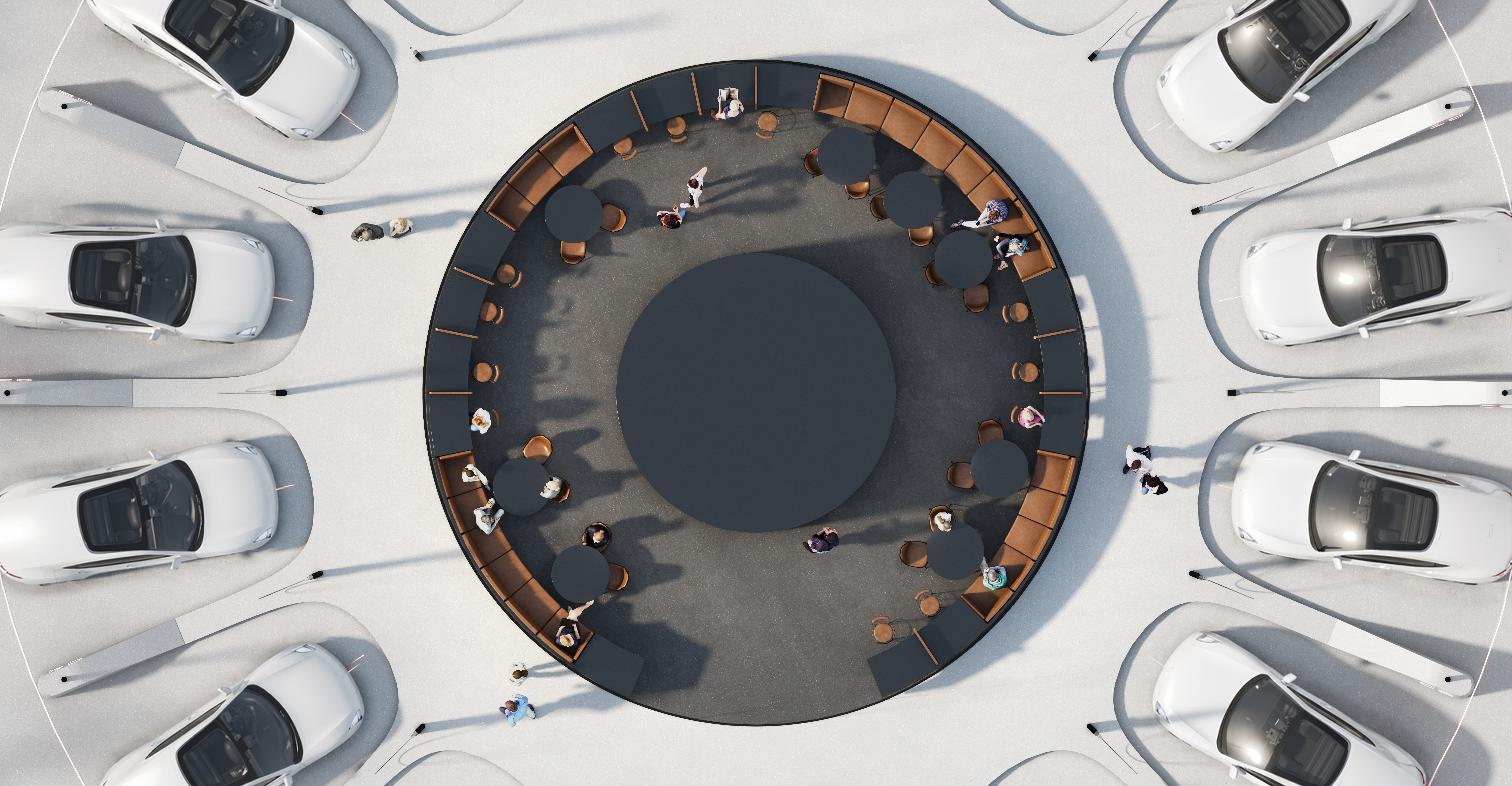 Aerial view of a circular outdoor seating area surrounded by white cars; people sit at round tables along the inner edge of the circle.