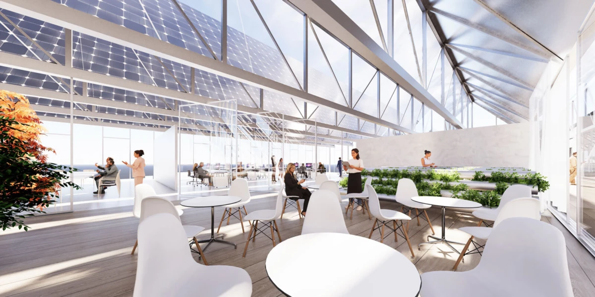 Glass-walled atrium cafe with white round tables and chairs; people sit, chat, and walk under a solar-panel roof.