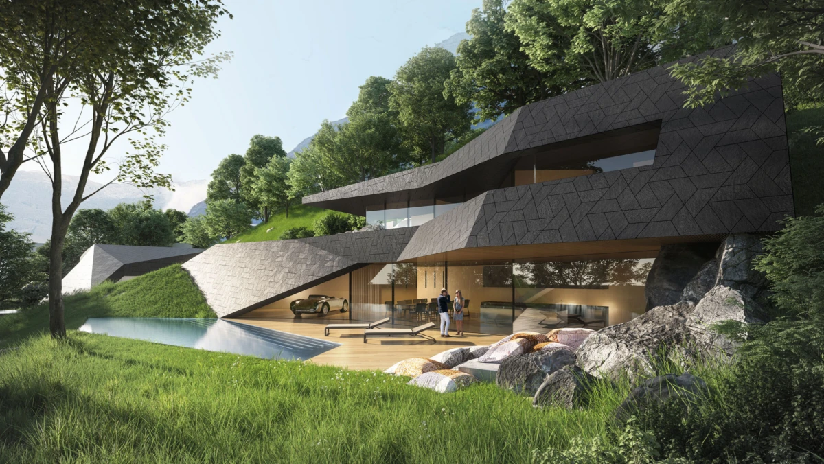 Modern hillside residence with angular dark-gray facade and glass walls; pool, landscaping, and two people standing inside near the living area.