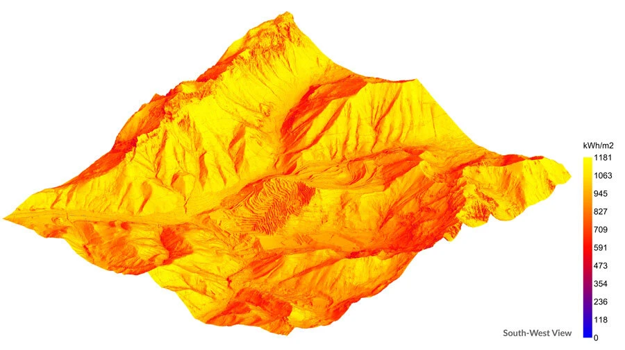 Three-dimensional mountain terrain model colored by a kWh/m2 energy scale, southwest view.
