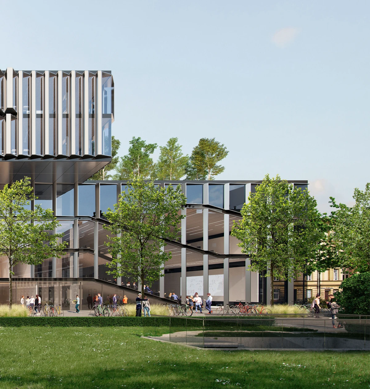 Modern glass-and-steel office building with vertical fins, trees lining a plaza, pedestrians and cyclists nearby.