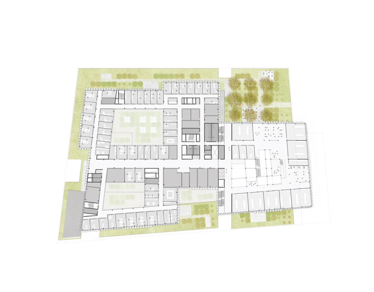 Architectural site plan of a multi-wing building complex with inner courtyards and surrounding green landscaping.