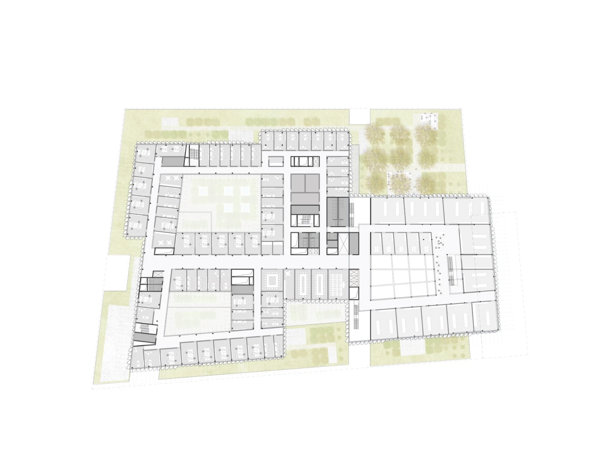 Architectural floor plan of a large building complex with a central courtyard, connecting wings, and surrounding green spaces.