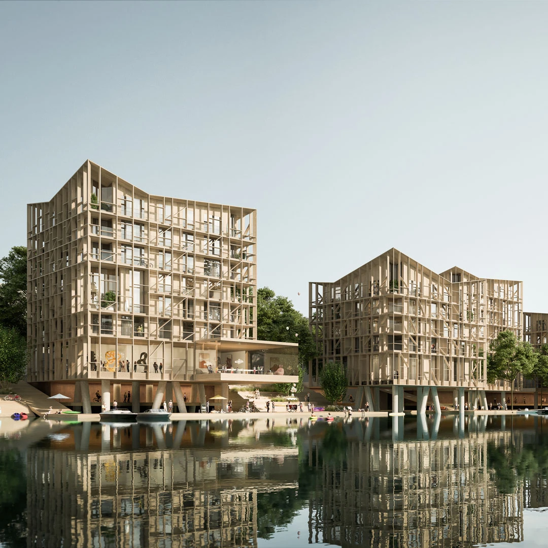 Timber-framed apartment buildings beside a calm river, with people strolling on a waterfront plaza and boats reflecting in the water.