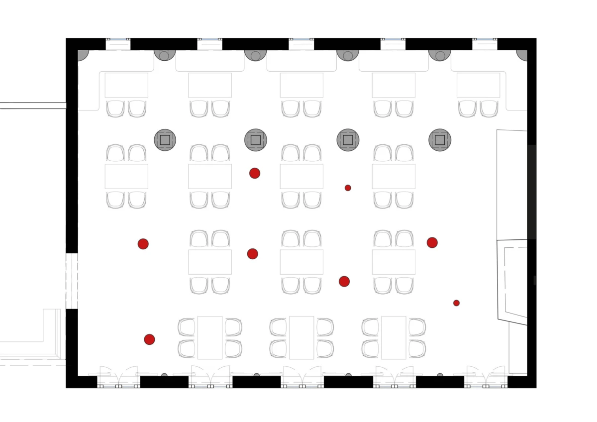 Floor plan of a rectangular event hall showing rows of four-seat square tables, grey chairs, and scattered red markers.