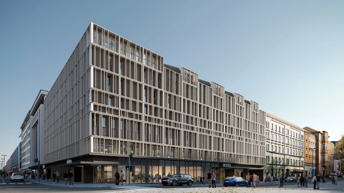 Modern hotel building with a grid-like steel-and-glass facade on a busy city street; pedestrians pass by.