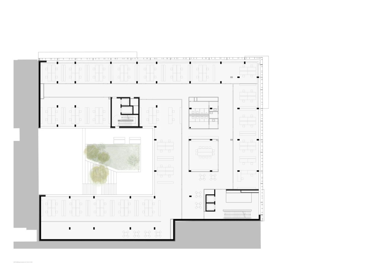 Office building floor plan showing a central courtyard with trees, surrounding open-plan work areas, meeting rooms, and corridors.