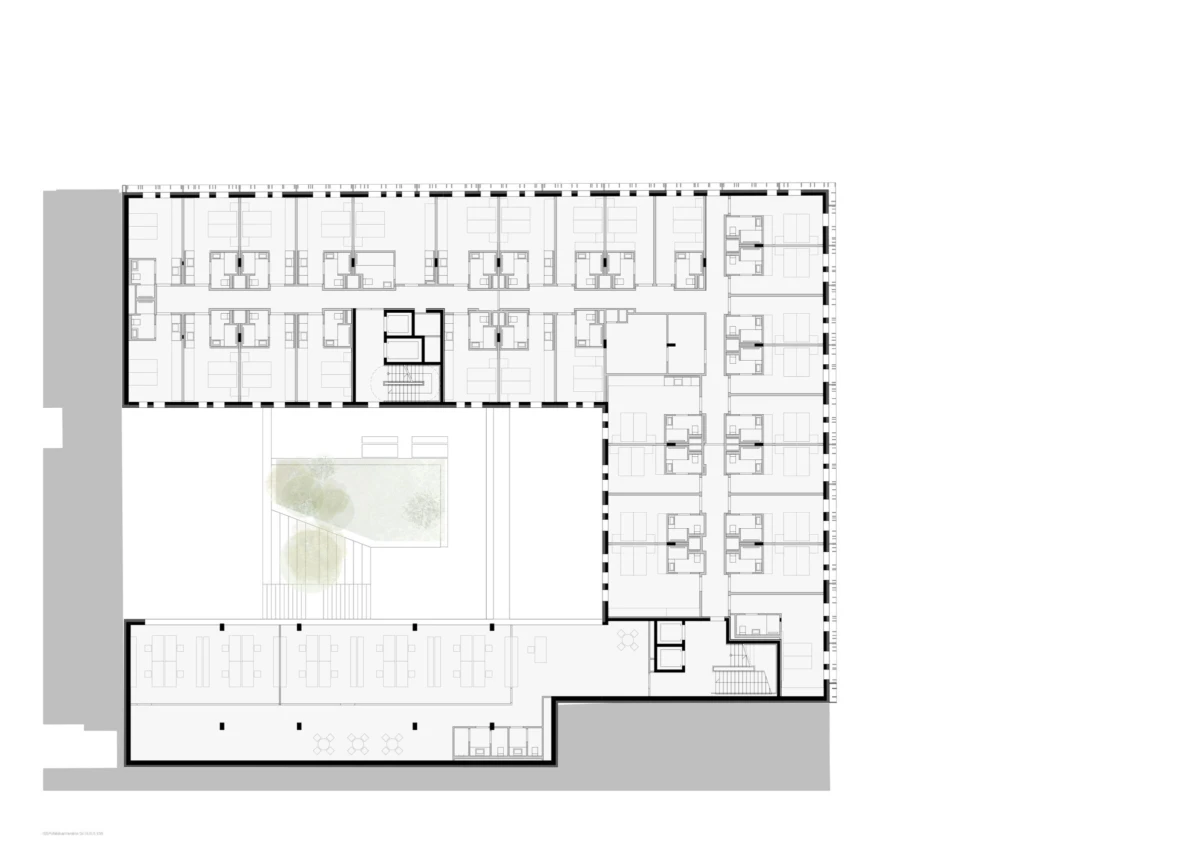 Plan view of an L-shaped office building with a central courtyard and multiple office suites.