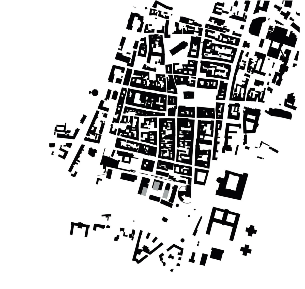 Aerial view of densely packed rectangular buildings forming a circular urban block pattern.