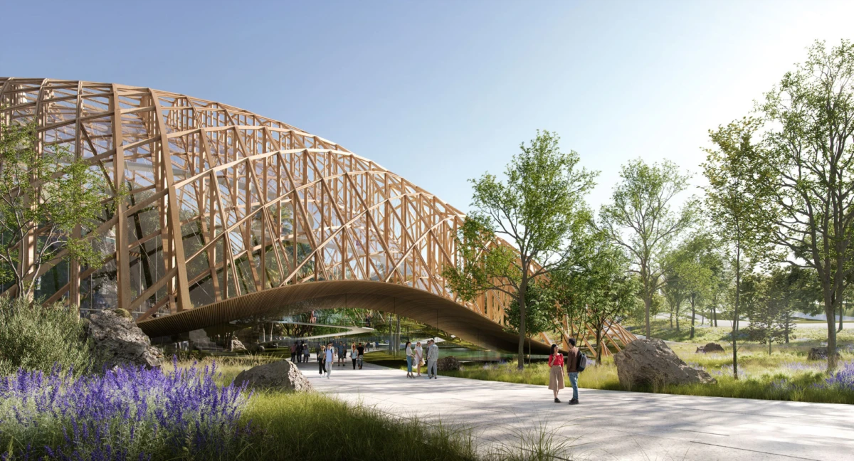 Wooden lattice arch spans a park path; people walk beneath among trees and lavender.