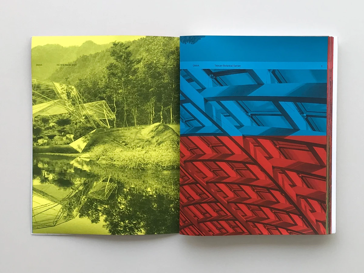 Two-page magazine spread: left page shows a green landscape with trees and water reflection; right page shows blue and red geometric patterns.