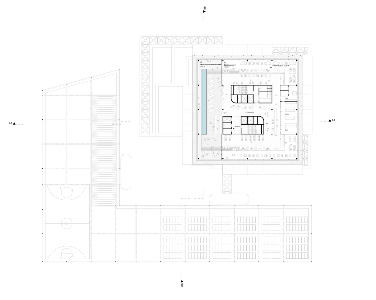 Architectural floor plan of a multi-wing building around a central courtyard, with stairwells, elevators, and an adjacent sports court.