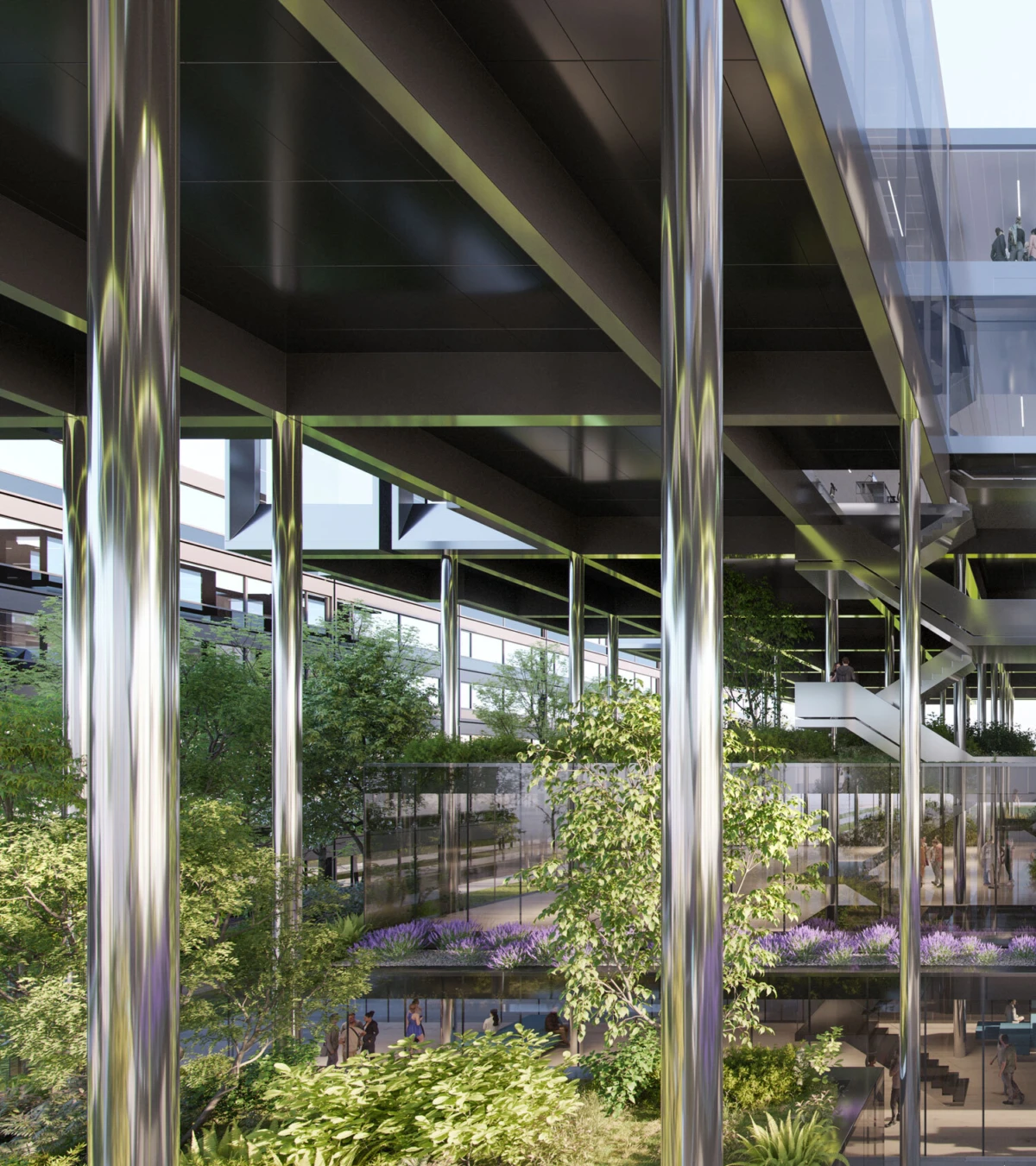 People walking through a modern office atrium with chrome columns, glass walkways, and a lush indoor garden.
