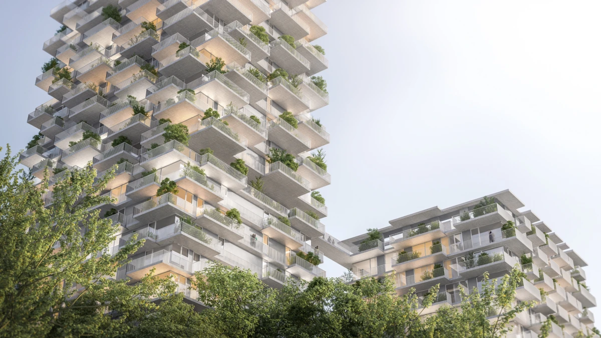 Two modern high-rise residential towers with cascading, plant-filled balconies and a connecting skybridge, set among green trees.