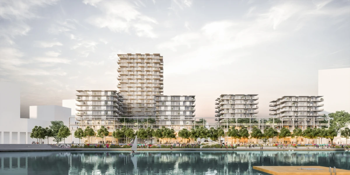 Contemporary apartment buildings along a tree-lined waterfront promenade; pedestrians stroll as a sailboat glides by.