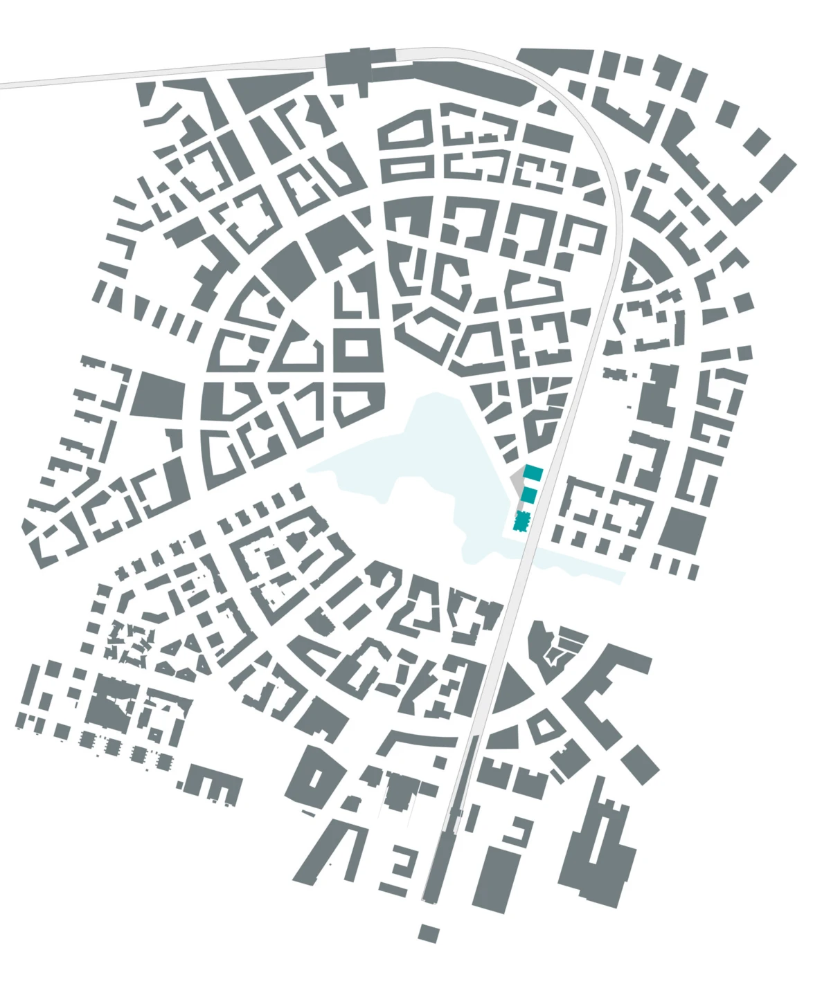 Stylized city map with dense block buildings, a central lake, and a curved road; turquoise-highlighted site along the road.