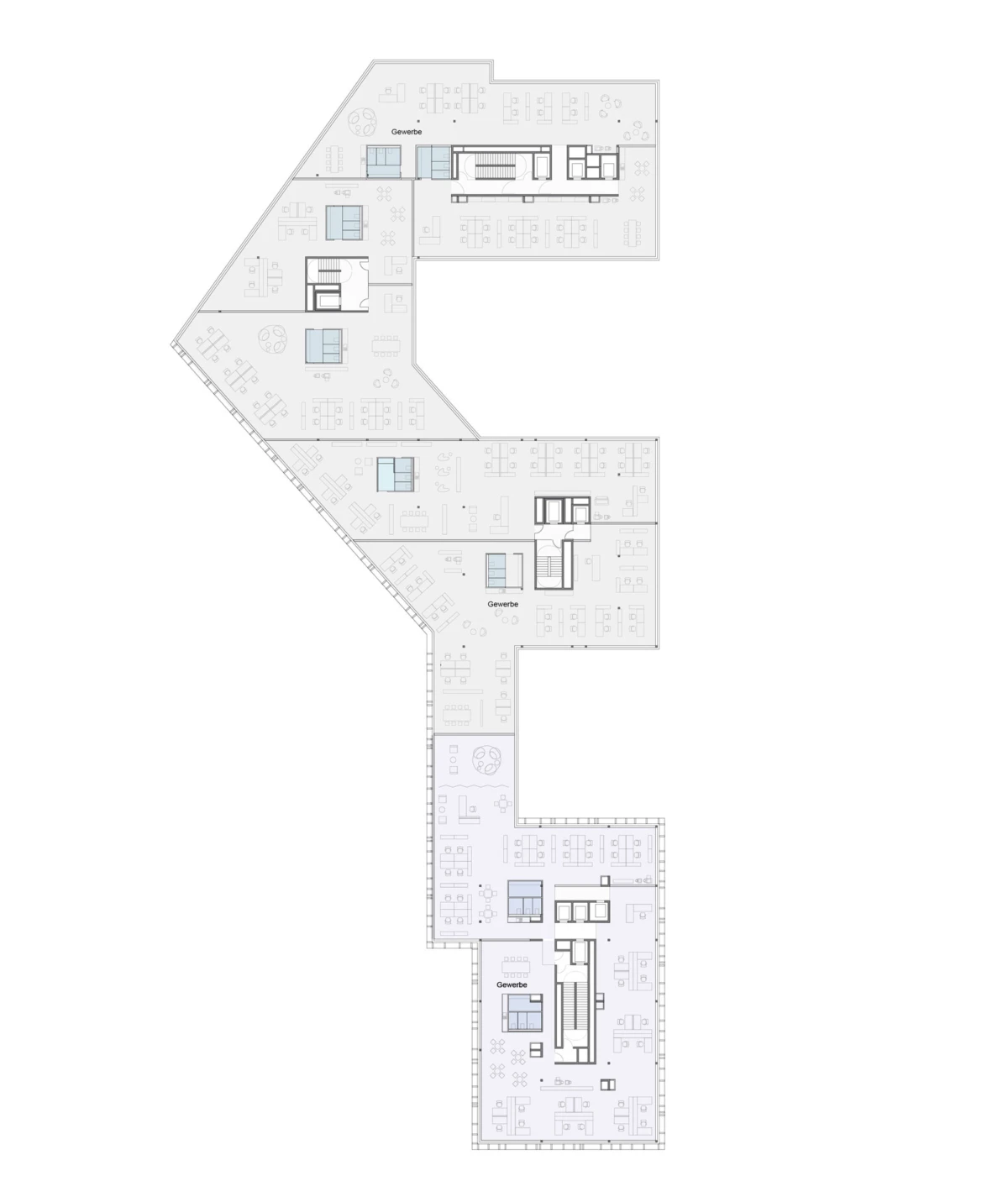Floor plan of a multi-wing commercial office building with workstations, corridors, stairs, and elevators.