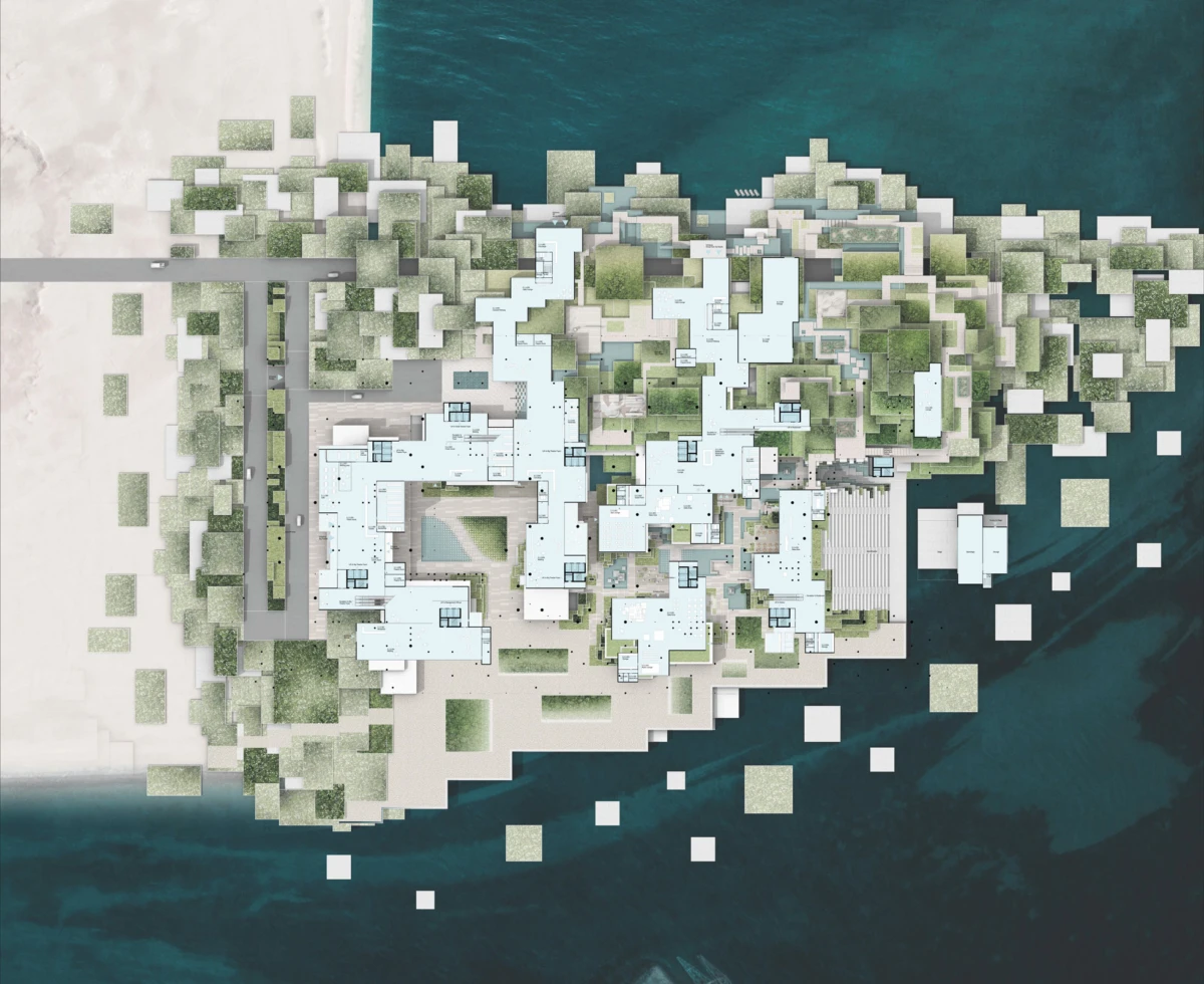 Aerial view of a modern architectural complex on a narrow island, pale-blue and white buildings with greenery beside turquoise water.
