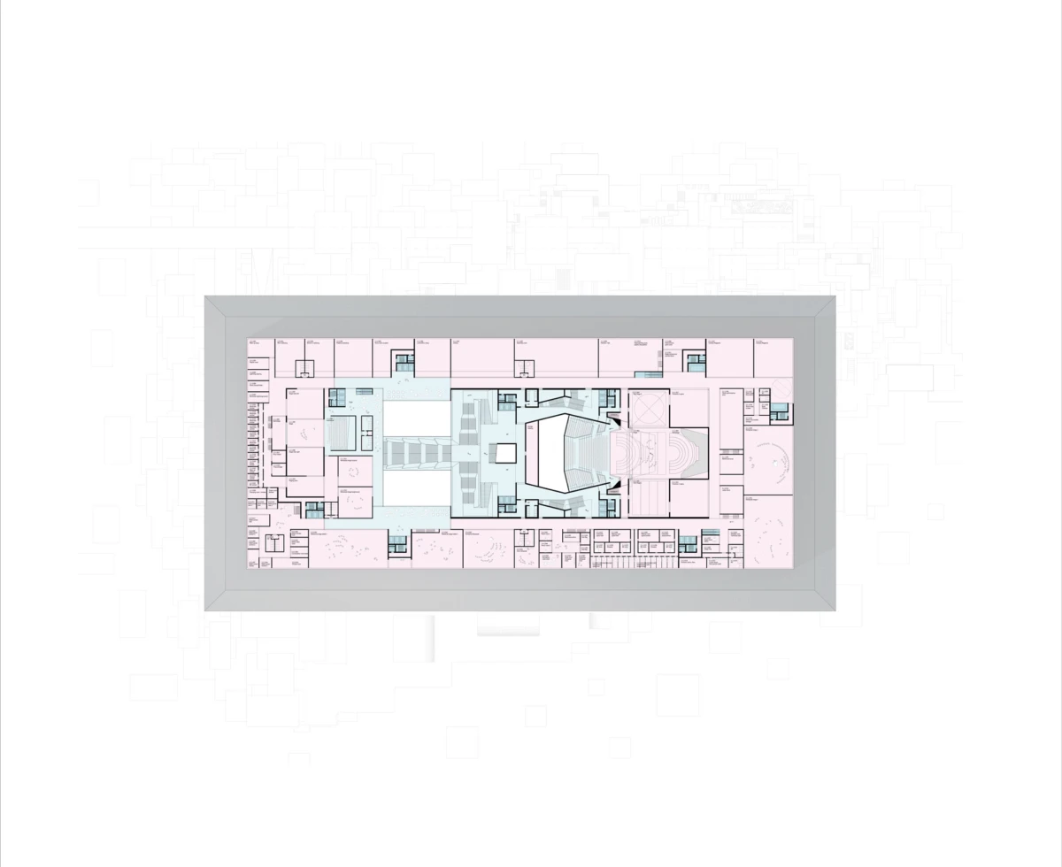 Top-down architectural floor plan of a rectangular building; central auditorium with seating surrounded by multiple rooms; pink and blue zones.