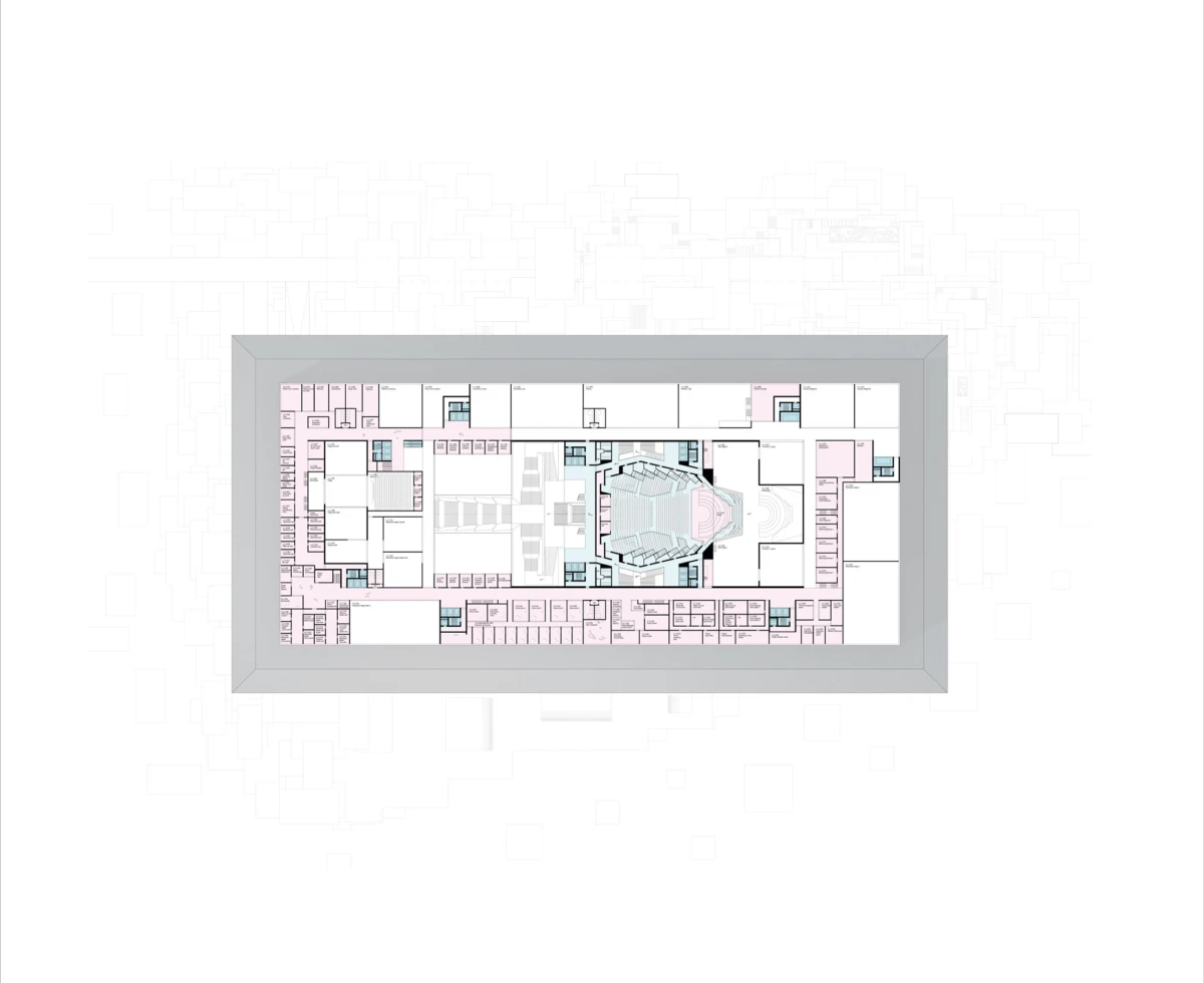 Architectural floor plan of a rectangular building with a central auditorium and surrounding offices.