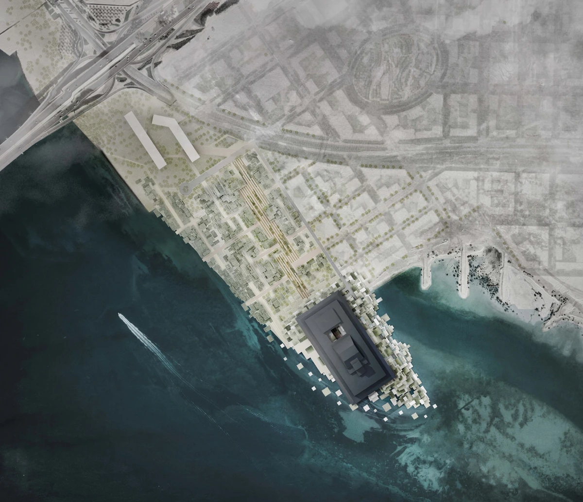 An aerial view of a coastal city with a dark rectangular building on a pier extending into the sea, dense street grid along the shoreline.