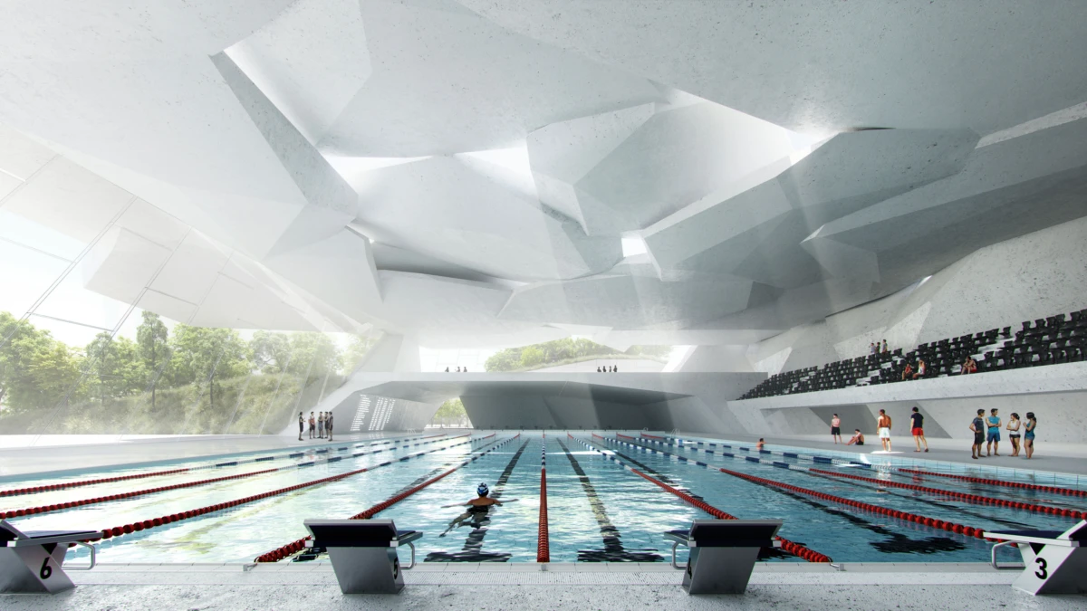 Indoor futuristic swimming pool arena with angular white ceiling; swimmer in lane; spectators in bleachers.