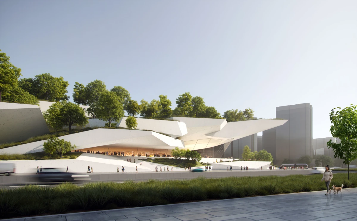Modern sculptural museum on a stepped hillside with trees; pedestrians on a plaza and a person with a dog on the sidewalk.