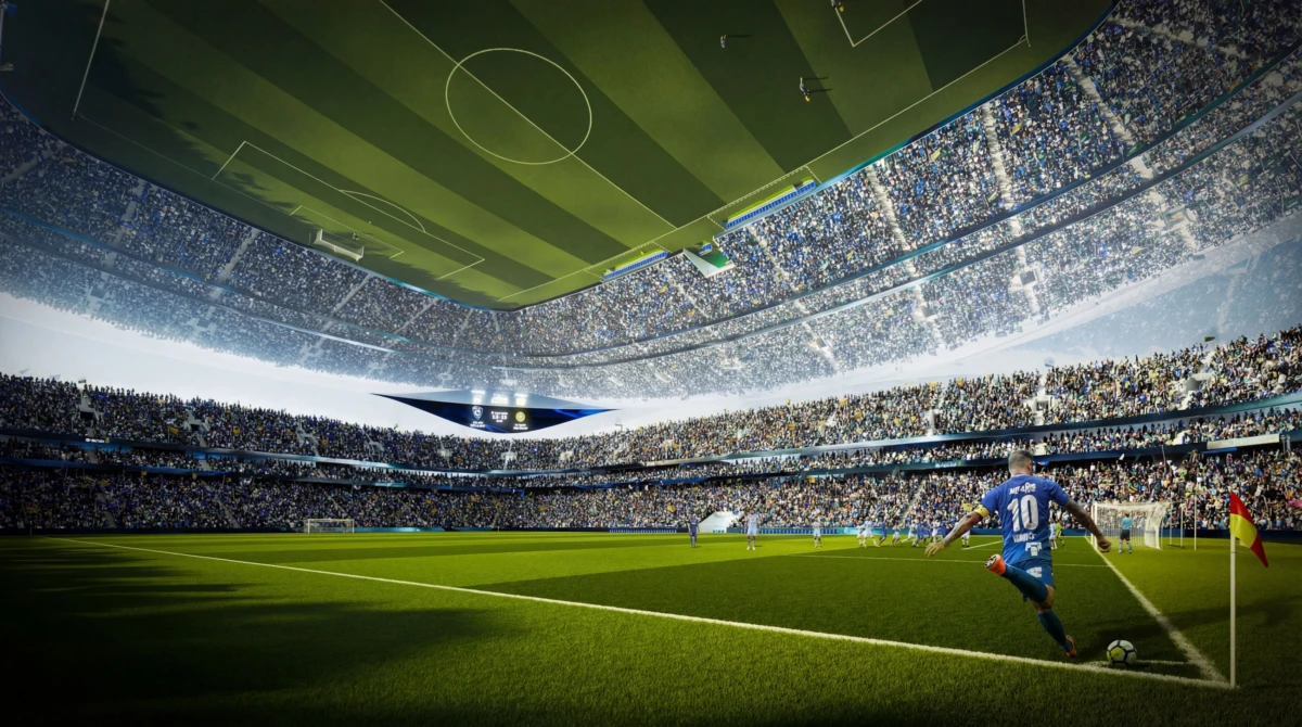 Blue-jersey soccer player wearing number 10 prepares to kick the ball near the corner flag in a packed stadium.