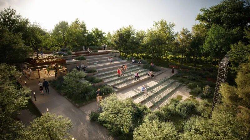 People seated on stepped benches in an outdoor terraced amphitheater in a park, surrounded by trees.