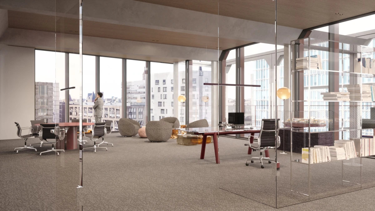 Businessperson in a light suit standing by floor-to-ceiling windows, talking on a smartphone in a modern glass-walled office.