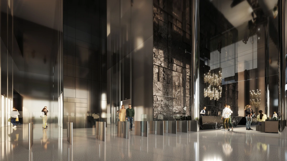 Modern hotel lobby interior with marble walls and glass panels; people walk and stand near a reception area under chandeliers.