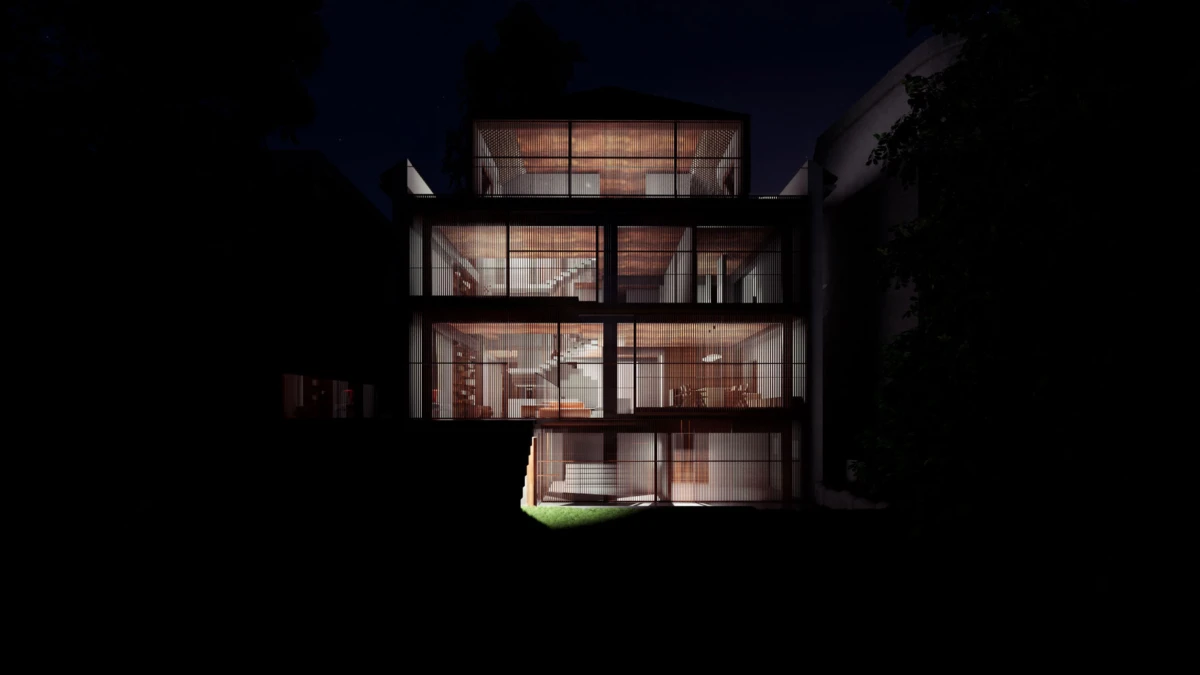 Three-story glass-fronted house with illuminated interiors and visible staircase, set at night.