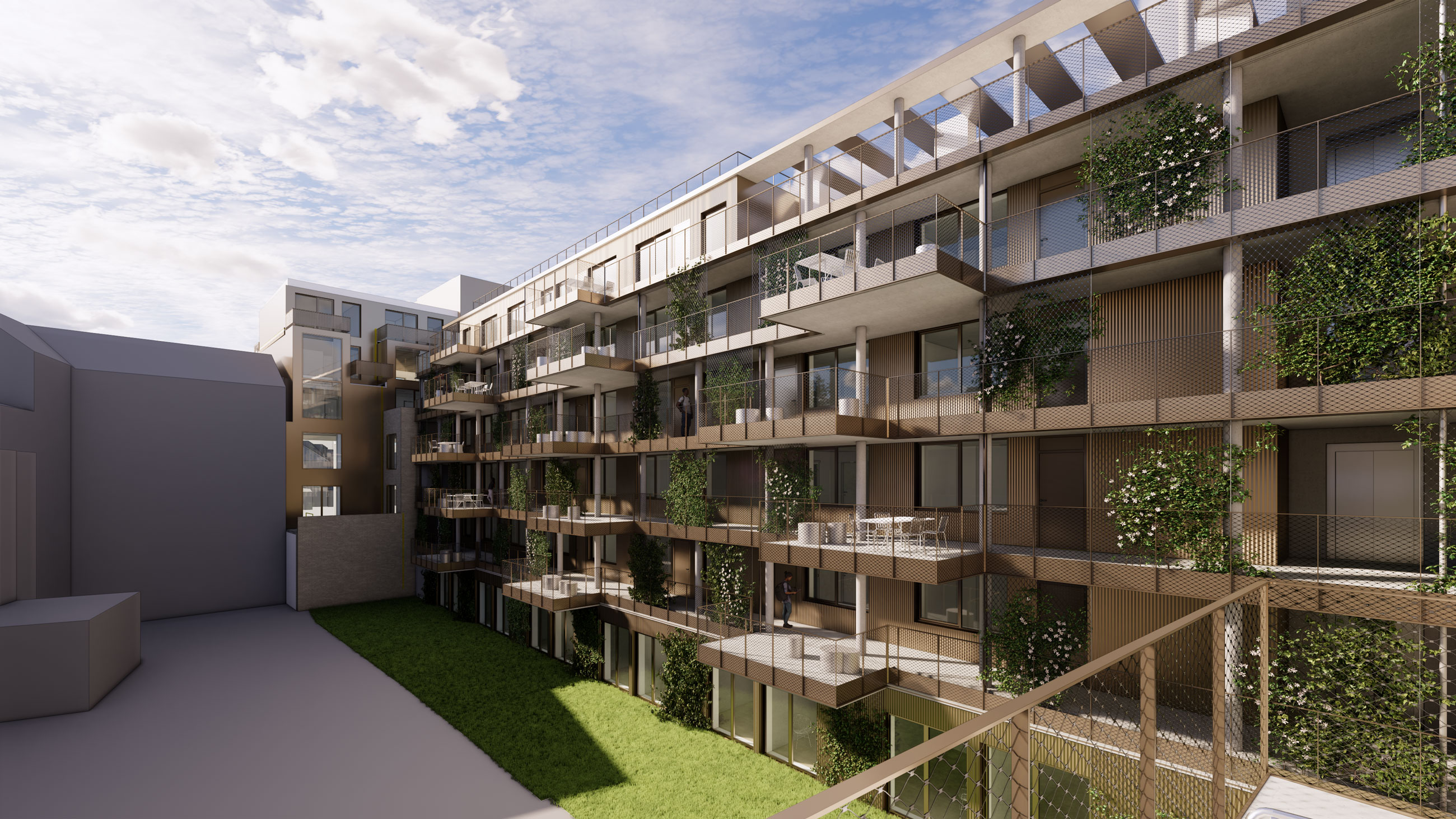 Modern apartment building with green balconies around a grassy central courtyard; a resident stands on a balcony.