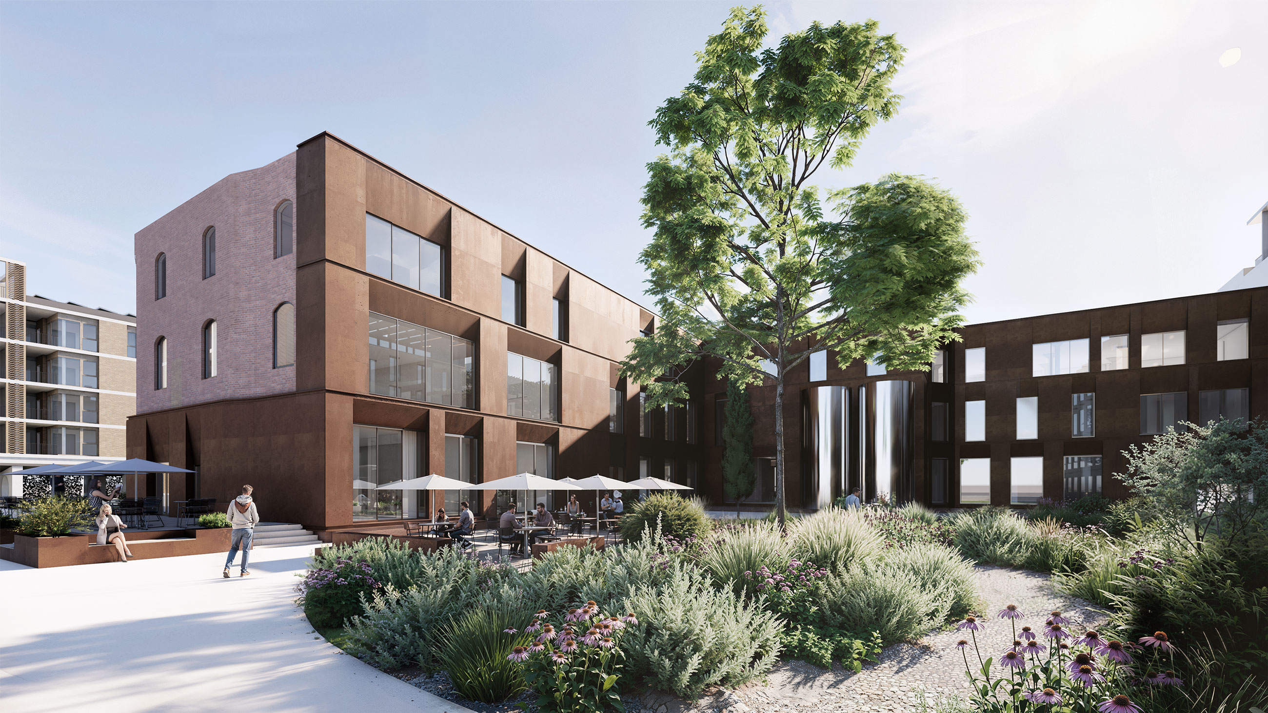Modern brick building complex with outdoor cafe seating under umbrellas, people strolling, and a large tree in a landscaped courtyard.