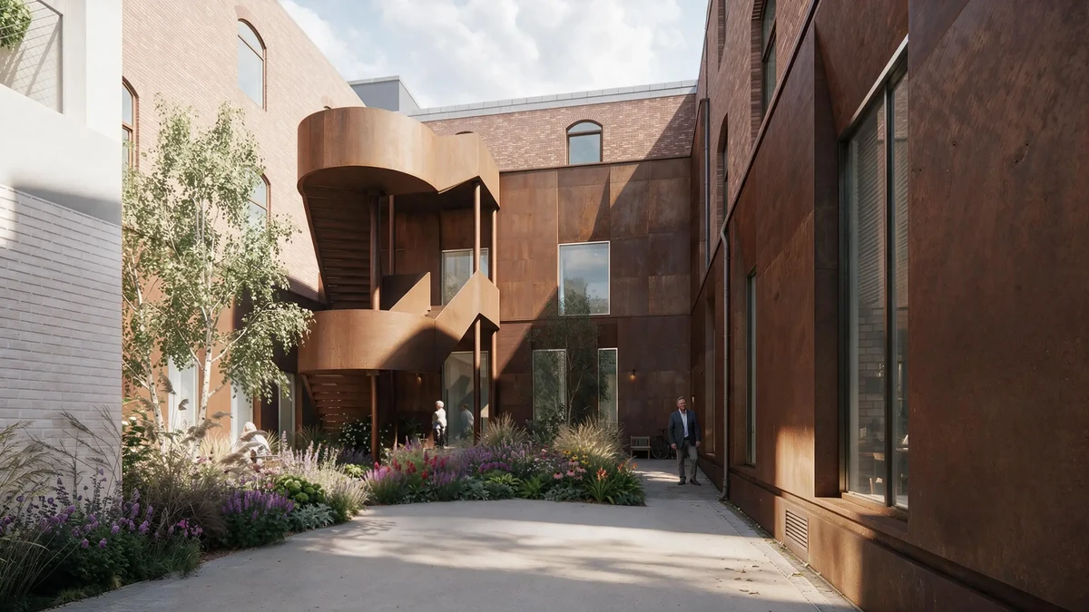 People walk through a rust-colored courtyard with a spiraling metal staircase and lush garden.