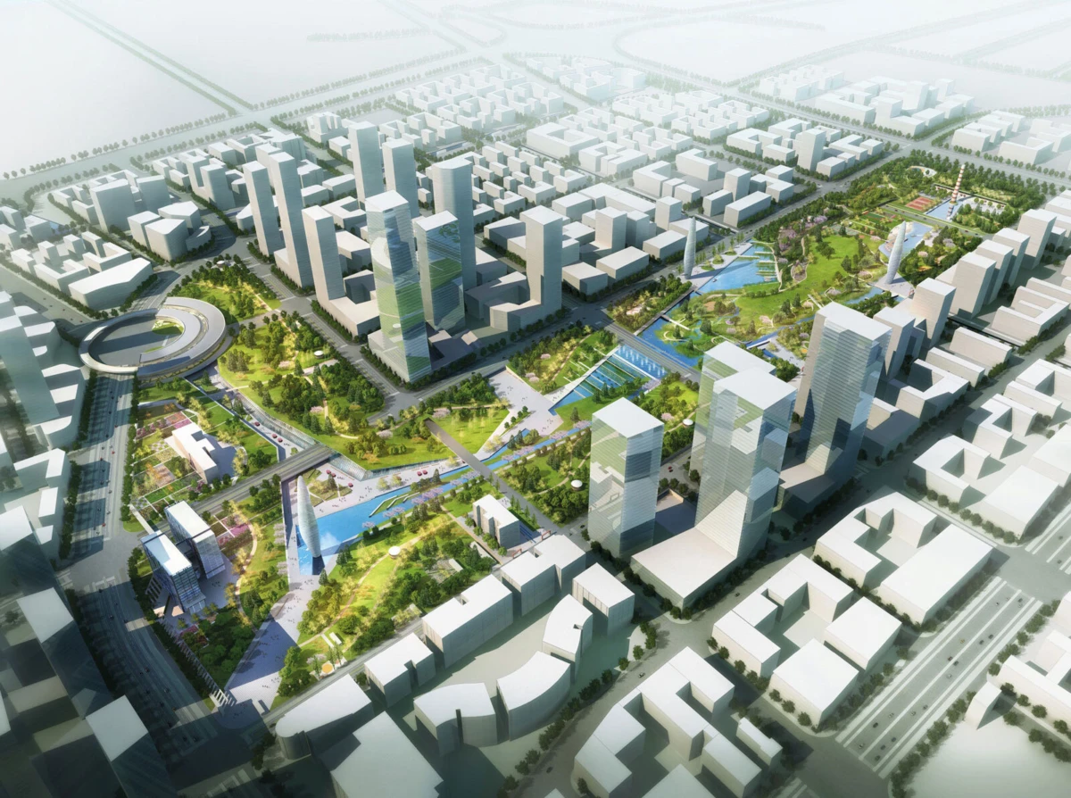 Aerial view of a planned city with tall glass towers, expansive green parks, waterways, and pedestrian bridges.