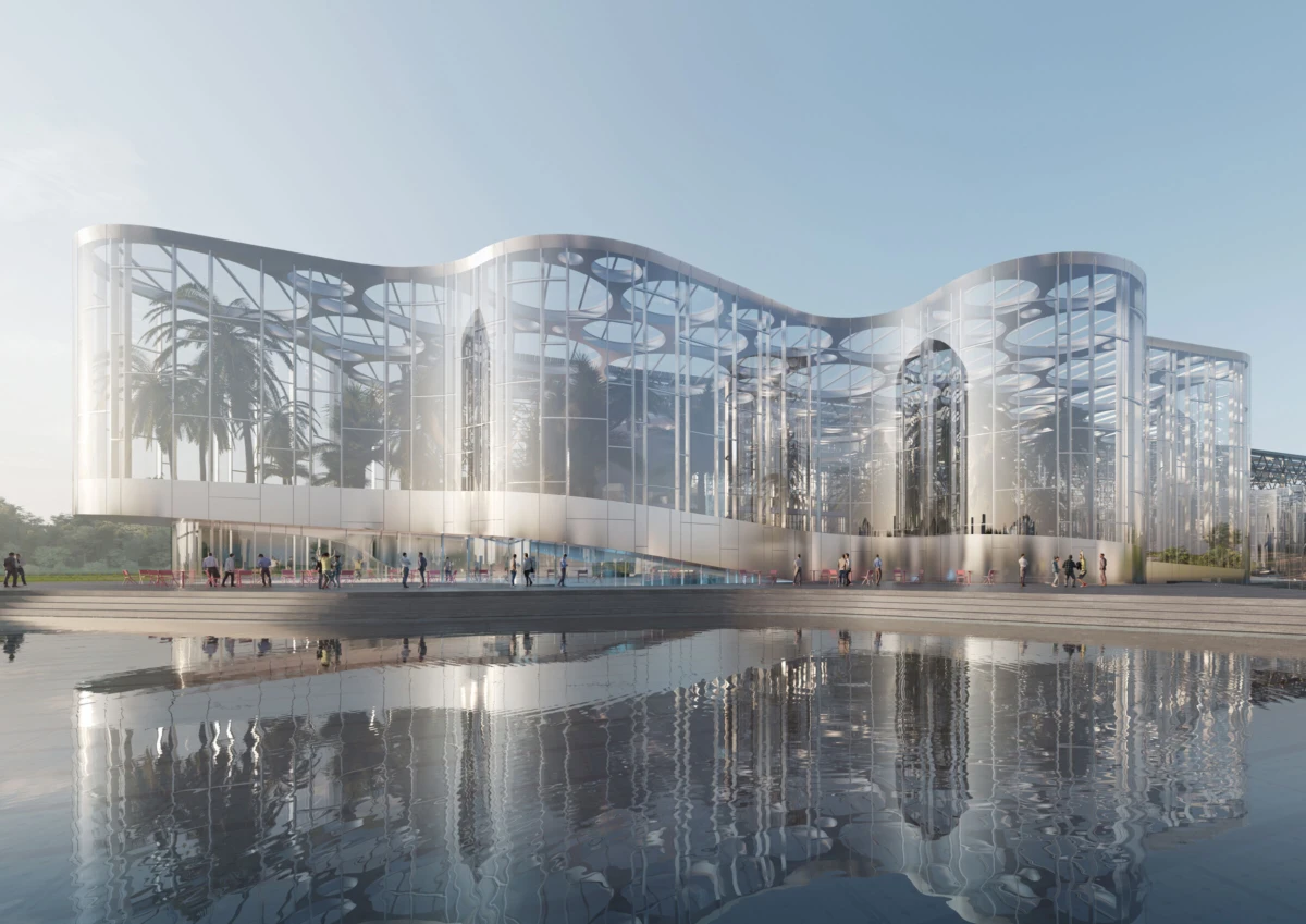 Futuristic glass building with a curving roof, reflected in a calm pool; pedestrians stroll along the outdoor plaza.
