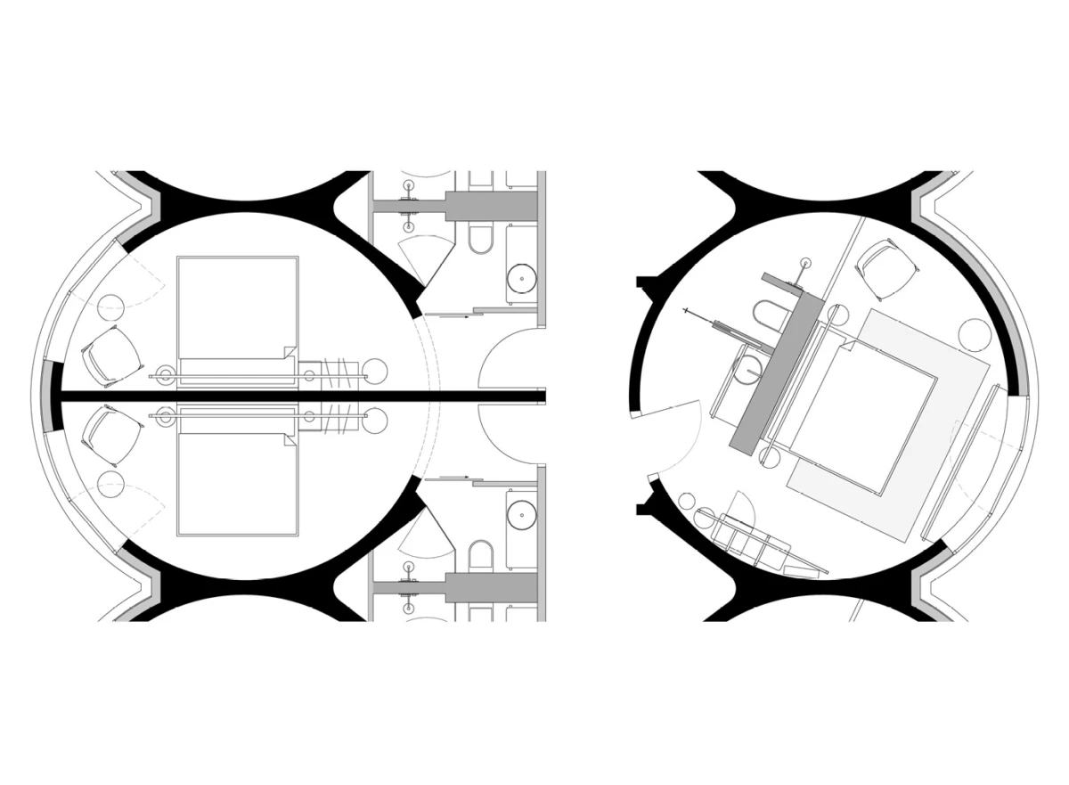 Top-down floor plan of two circular pods; left has two beds and seating, right has a bed, desk, and seating, connected by a corridor.
