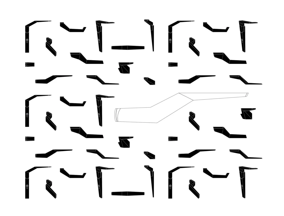 Black angular polygon fragments scattered on a white background; a pale elongated polygon extends across the center.