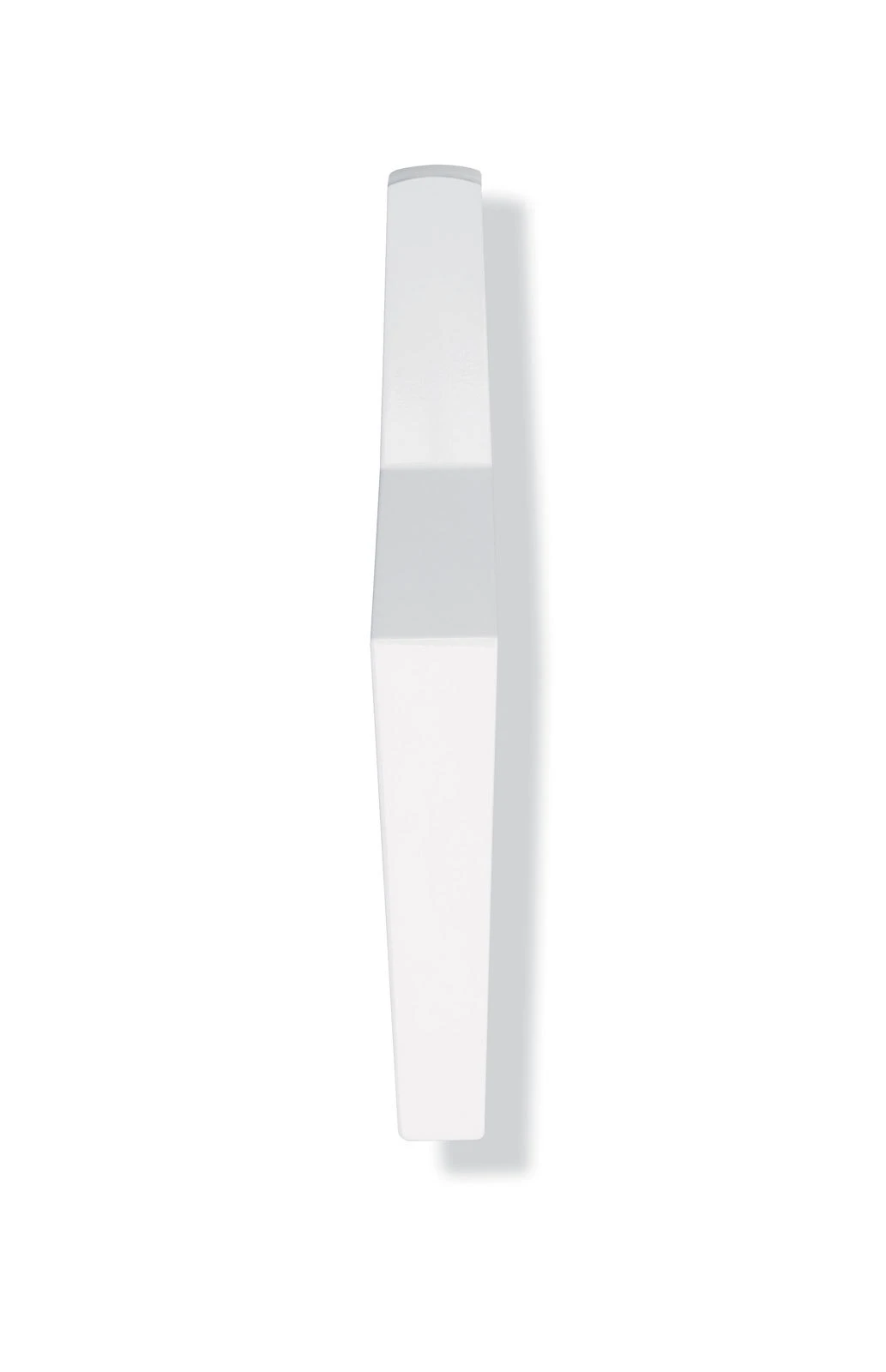 White faceted prism standing upright on white background