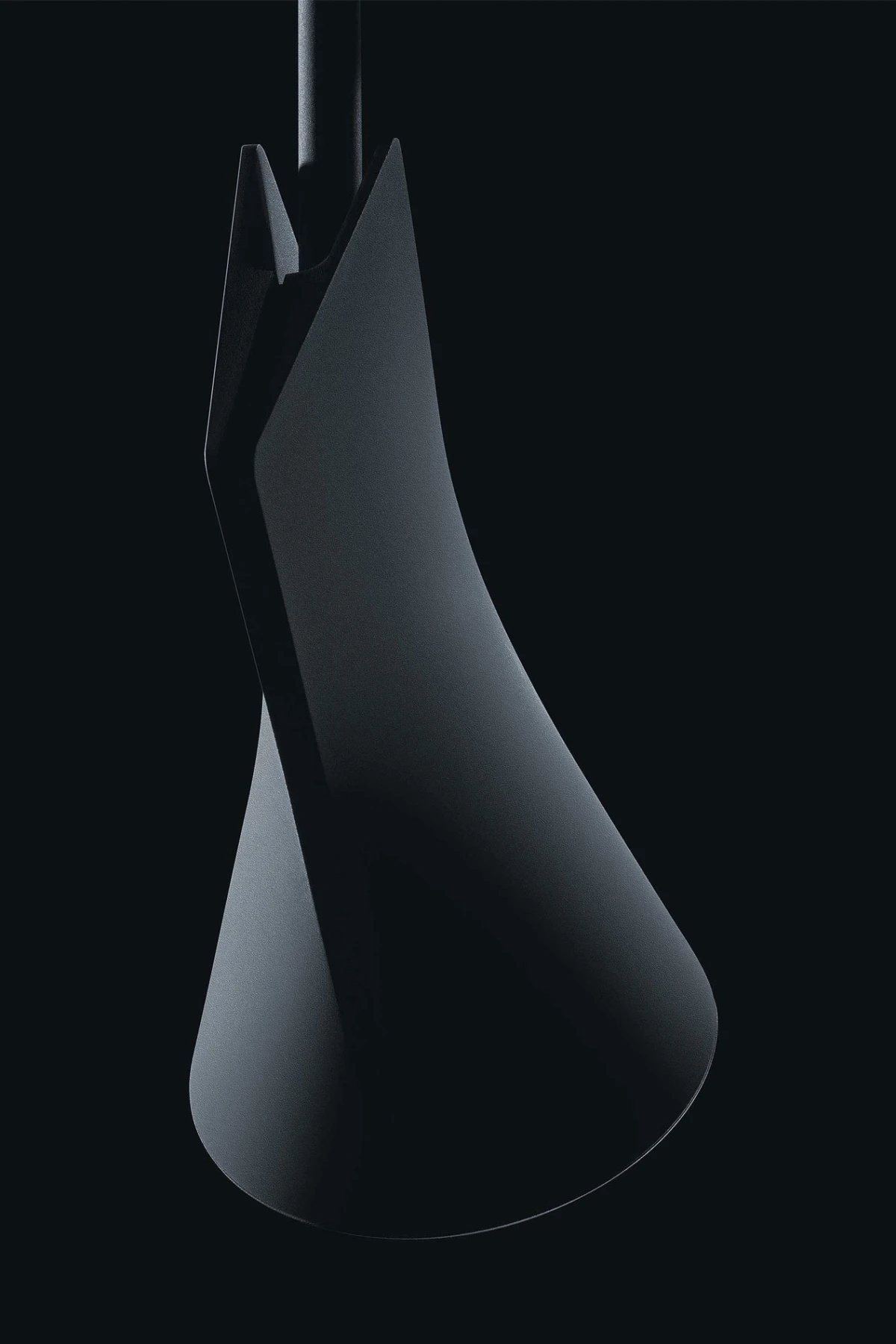 Abstract black metal sculpture with a twisting conical form, suspended from a thin rod against a dark background.