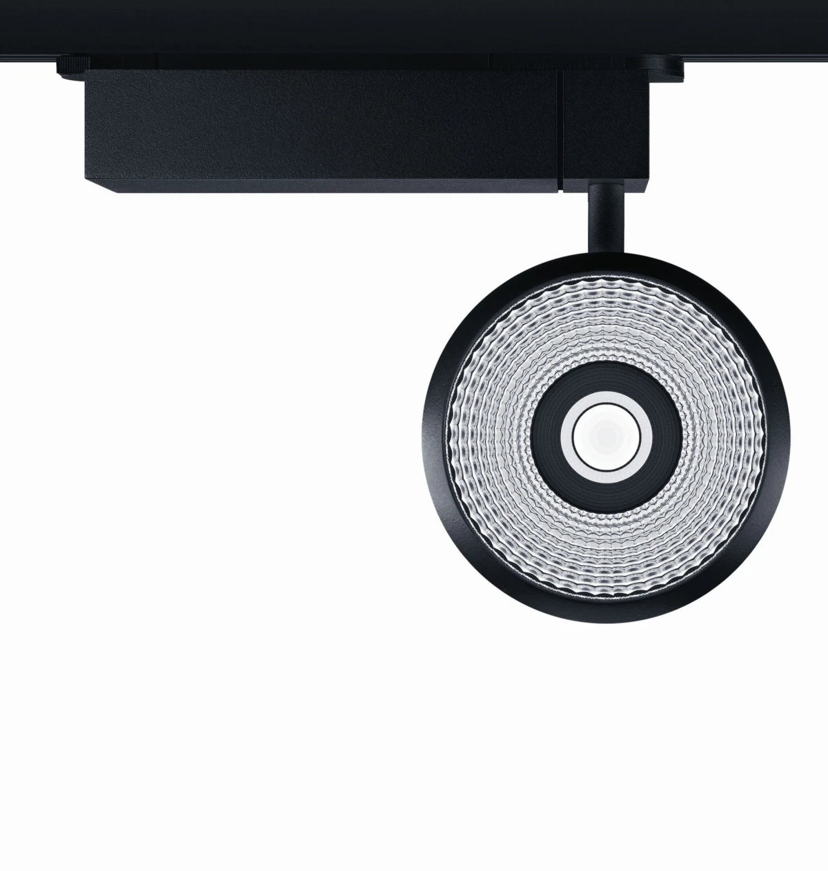 Black ceiling-mounted track spotlight with ribbed reflector, suspended from a track.