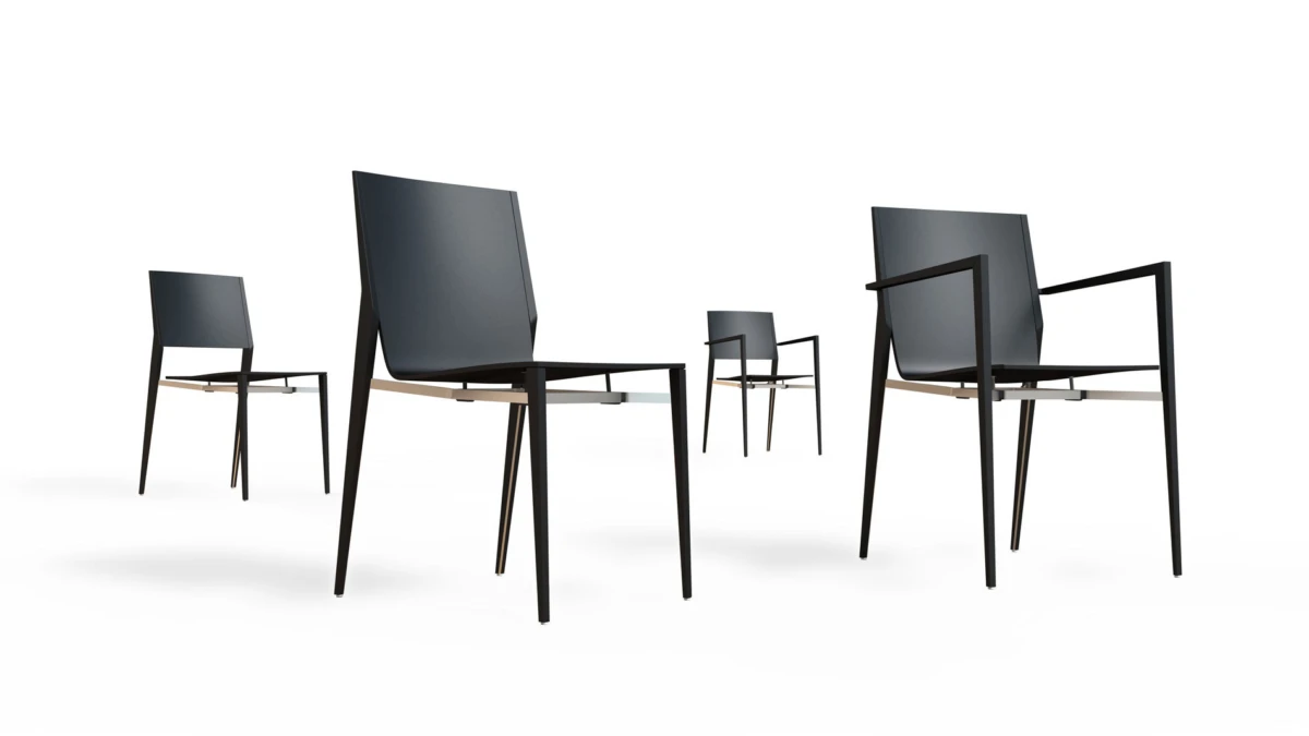 Five modern navy-blue upholstered chairs with slender metal legs, arranged in a white studio.