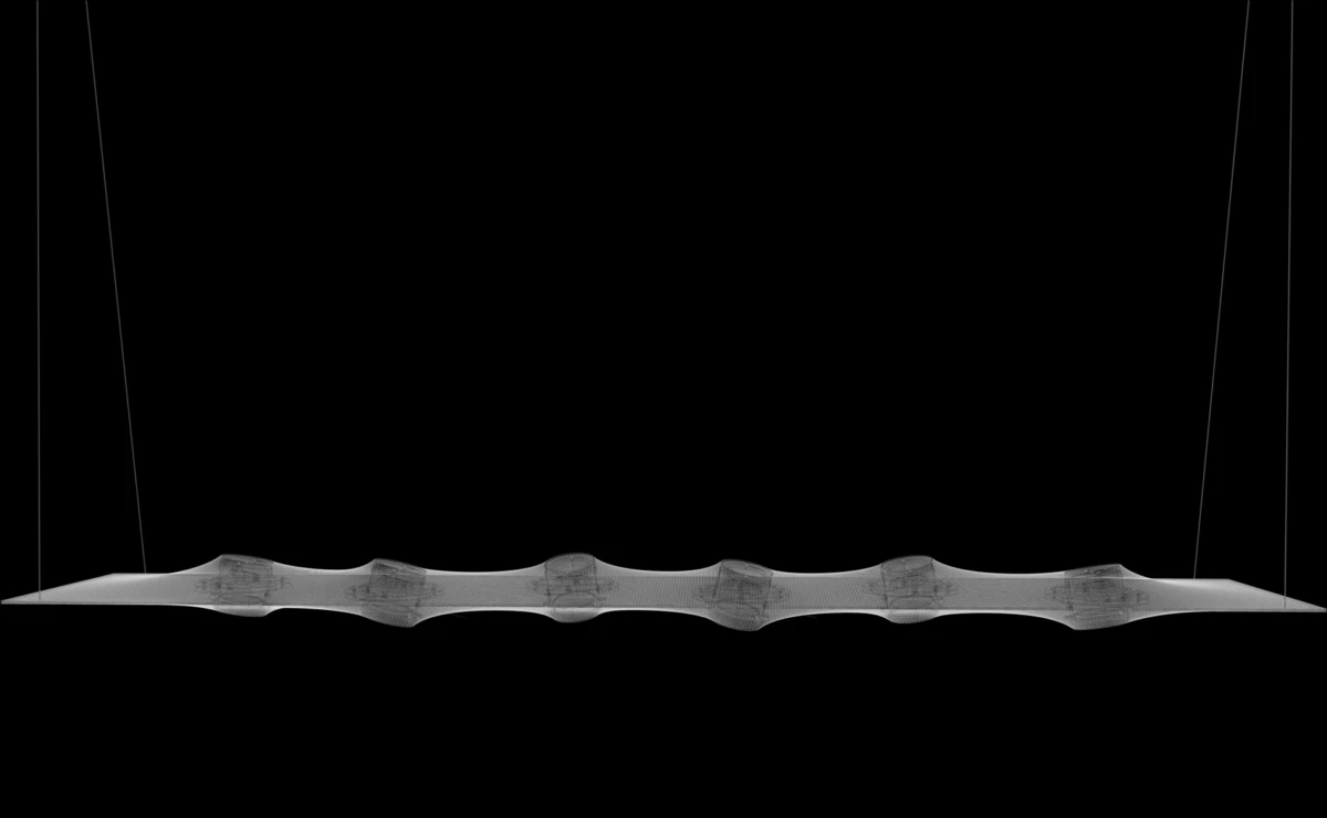 Translucent, undulating strip suspended by two thin cables against a black background.
